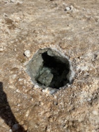 a hole in the ground with a hole in it