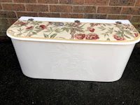 a white trunk with a floral pattern on it