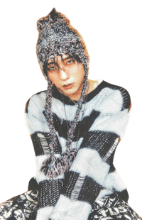 a man wearing a sweater and hat