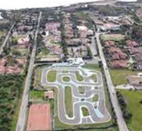 an aerial view of a golf course near the ocean