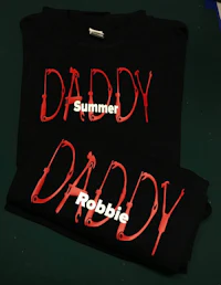 two t - shirts that say daddy and robbie