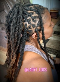 a woman with dreadlocks in her hair