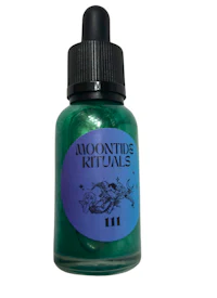a bottle of green liquid with the words mooning kittals on it