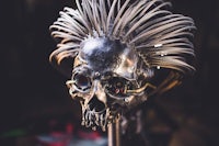 a skull made of metal with spikes on it