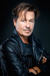 a man in a black leather jacket