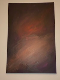 a painting of a purple and brown painting hanging on a wall