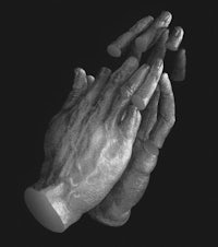a black and white image of a pair of hands