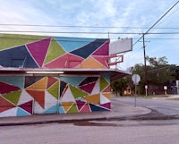 a colorful building with triangles painted on it