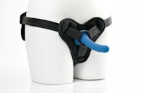 a mannequin wearing a black and blue harness