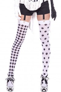a woman in black and white polka dot stockings