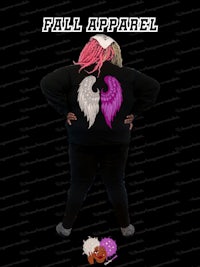 a woman wearing a black hoodie with pink and purple wings