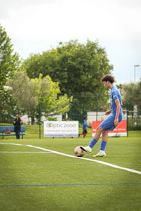 a man kicking a soccer ball
