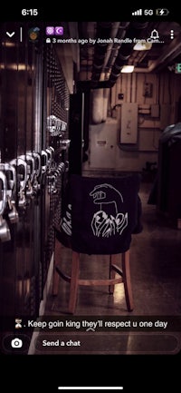 a picture of a room with lockers and a chair