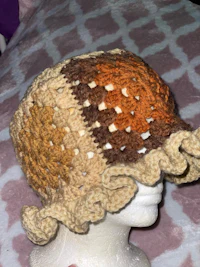a mannequin wearing a crocheted hat