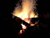 an image of a bonfire in the dark