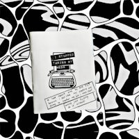 a black and white book with a typewriter on it