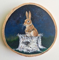 a painting of a rabbit sitting on top of a log