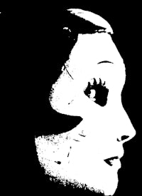 a black and white image of a woman's face
