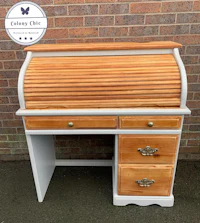 a white and wood desk with drawers
