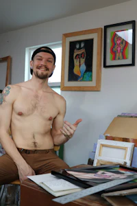 a man wearing a tan shirt