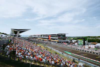 a crowd of people watching a race