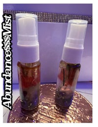 two bottles of essential oils on top of a table