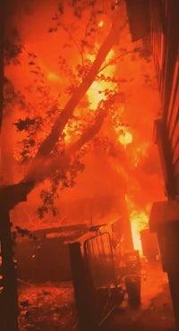 a house is on fire in the middle of the night