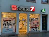 schuh 7 store on the corner of a street
