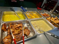a buffet with a variety of food on it