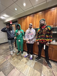 a group of people standing in a hallway
