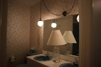 a bathroom with two sinks and a mirror