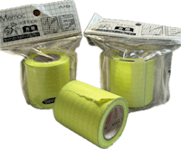 two rolls of yellow tape in a package