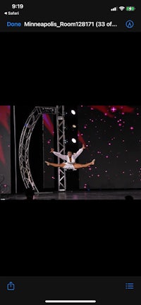a dancer is performing on stage in front of an audience