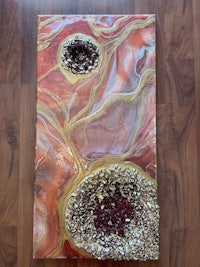 a piece of art with a red, orange, and yellow design