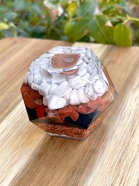 a small glass container filled with rocks and pebbles