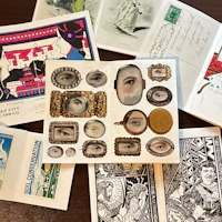 a collection of stamps, postcards, and other items