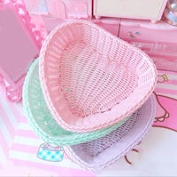 three wicker baskets stacked on top of each other