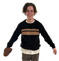 a young man wearing a sweater and a hat