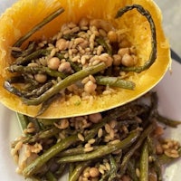 a plate filled with green beans and chickpeas