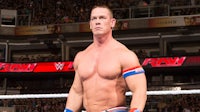 wwe wrestler john cena is standing in the ring