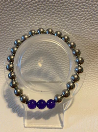 a bracelet with silver and blue beads