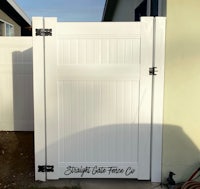 a white fence with a black lock on it