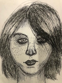 a black and white drawing of a woman's face