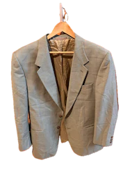 a light blue suit hanging on a hanger