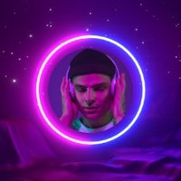 a man with headphones in front of a neon circle