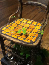 a chair covered in orange leaves