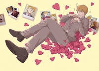 a man in a suit laying on a bed of hearts