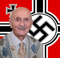 a man in a sweater with a nazi flag in front of him