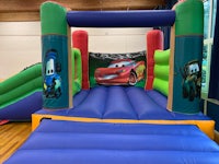a children's bounce house with cars on it