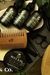 a set of beard care products on a wooden table